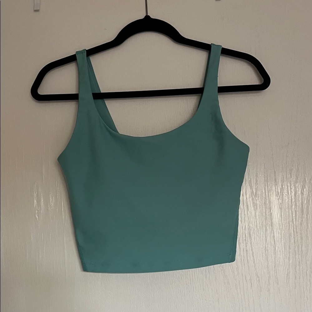 Cropped work out tank top with built in bra. Brand new without tags.